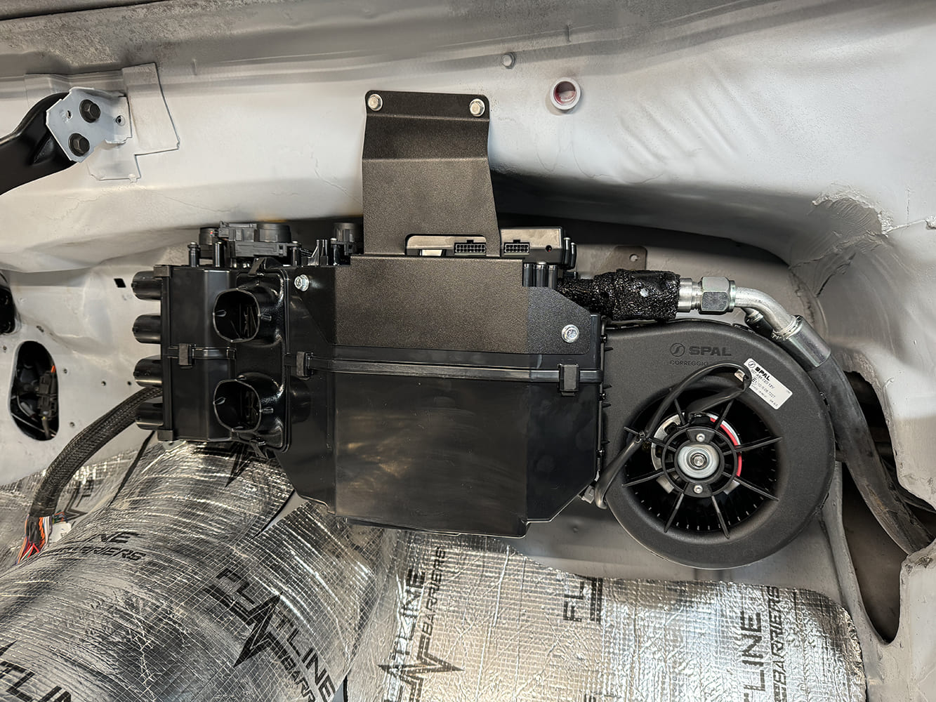 Full view of mounted evaporator case and blower motor inside the 1971 Camaro cabin
