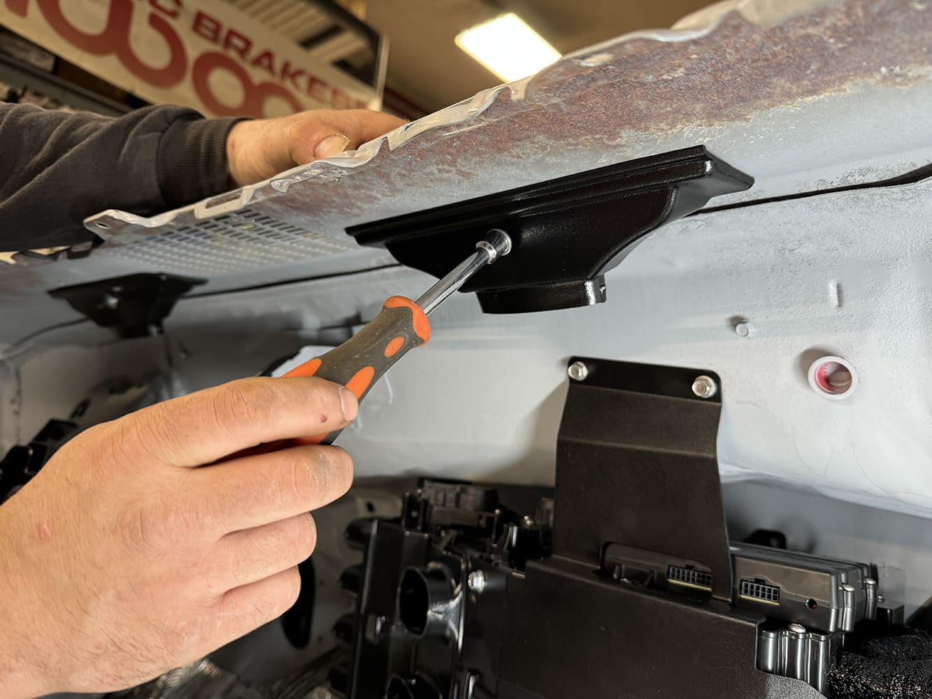 013 Installing defrost duct brackets beneath the dash cowl in the 1971 Camaro