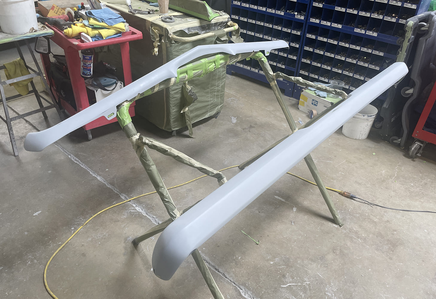019 1969 Camaro bumpers in primer surfacer final prepped for paint and installation