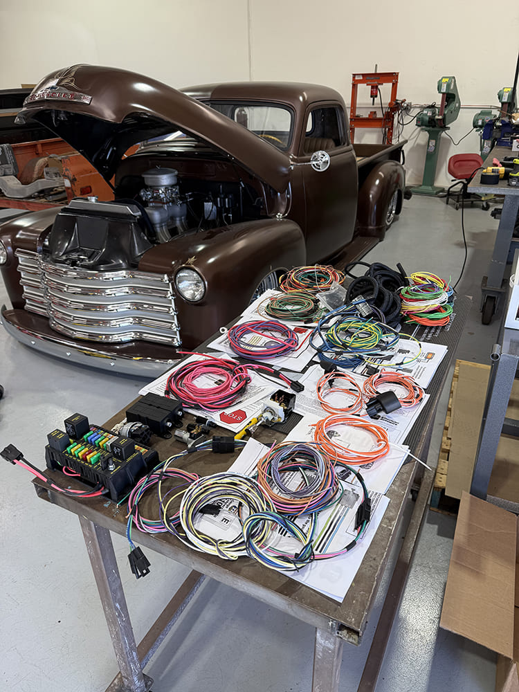 03 1948 chevy full vehicle rewire kit laid out on table with labeled wires