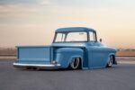 03 1957 Chevy truck rear profile showing custom tailgate integrated exhaust and shaved bumper