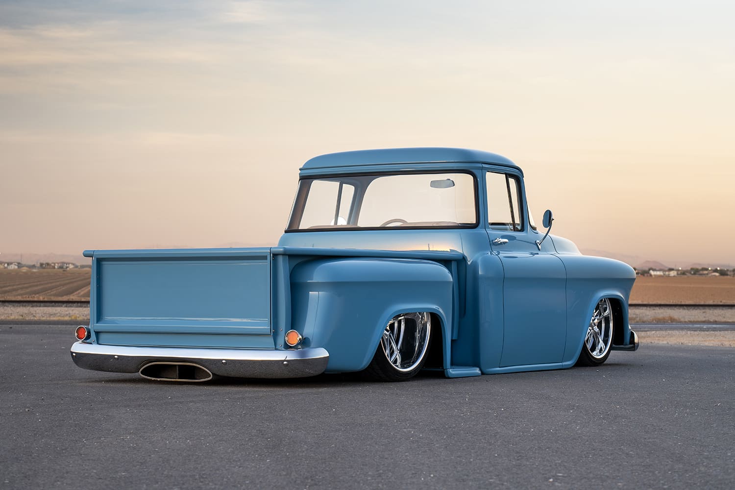 03 1957 Chevy truck rear profile showing custom tailgate integrated exhaust and shaved bumper