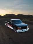 03 1993 Chevy OBS show truck lowered on large billet wheels with candy fade graphics