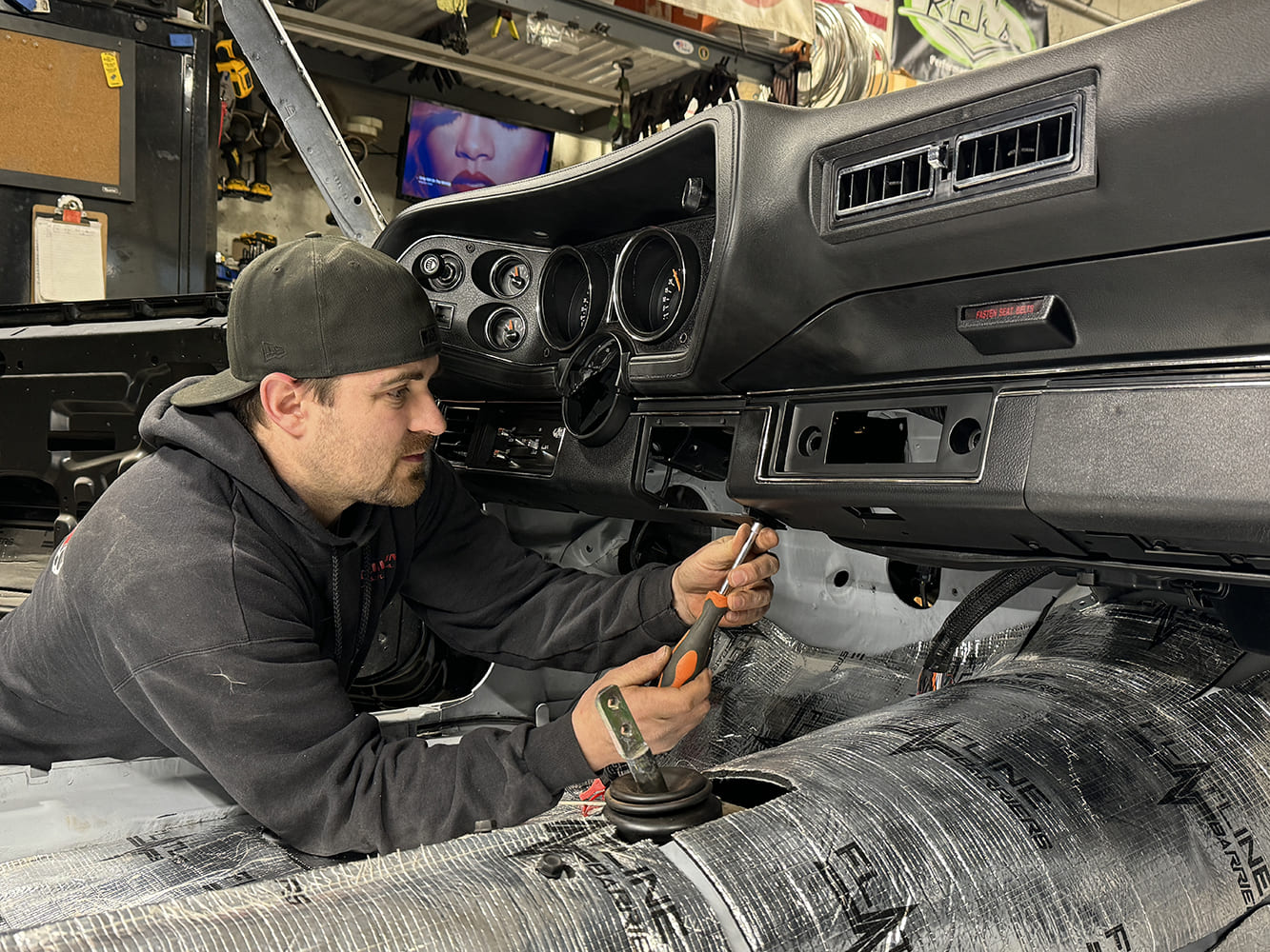 033 Securing lower dash trim during interior assembly of a 1971 Camaro