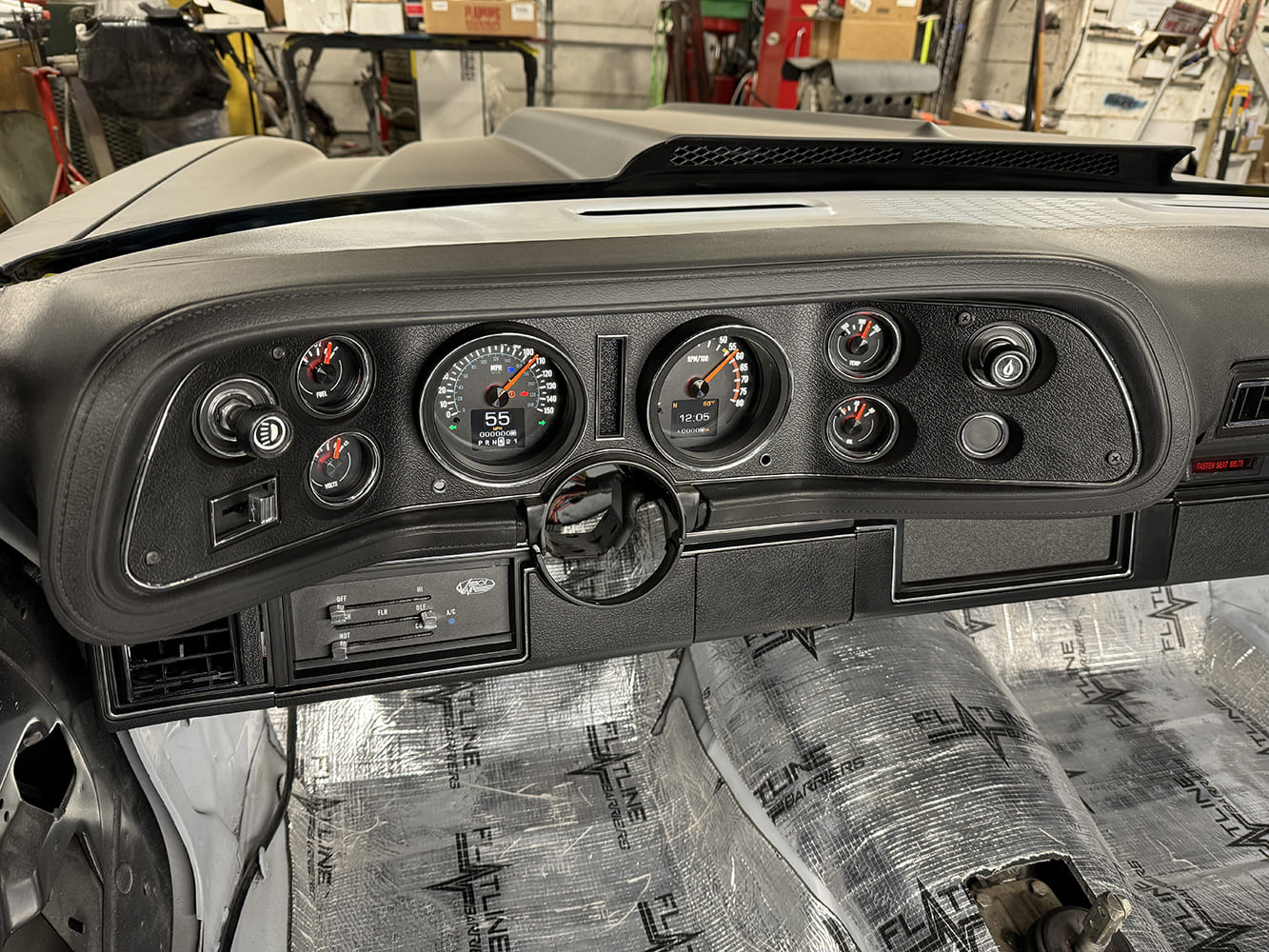 034 Fully installed gauge cluster and AC controls in the restored dash of a 1971 Camaro