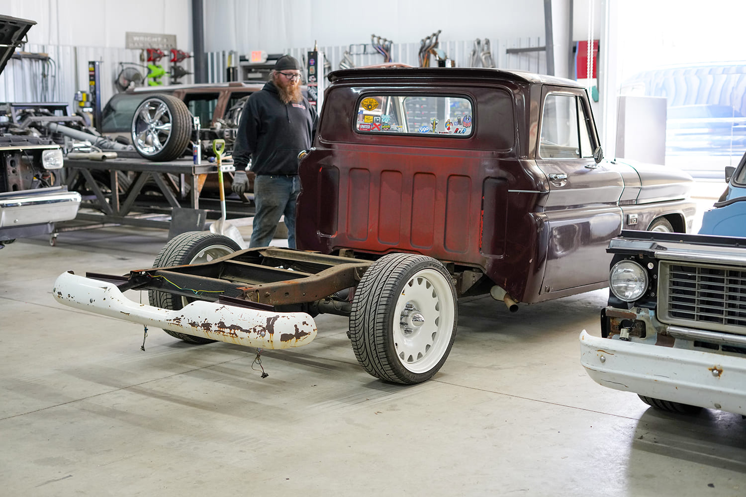 06 Partial disassembly of C10 shows tailgate area prepped for steel bed swap with bumper off