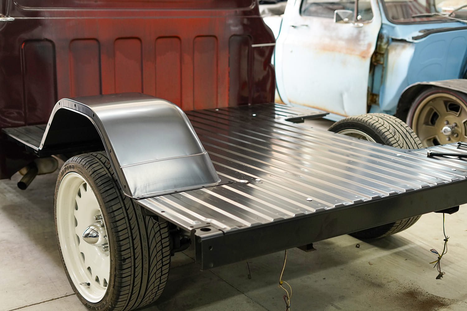 11 The new wheel tub is test fitted to the C10’s steel bed floor before final alignment