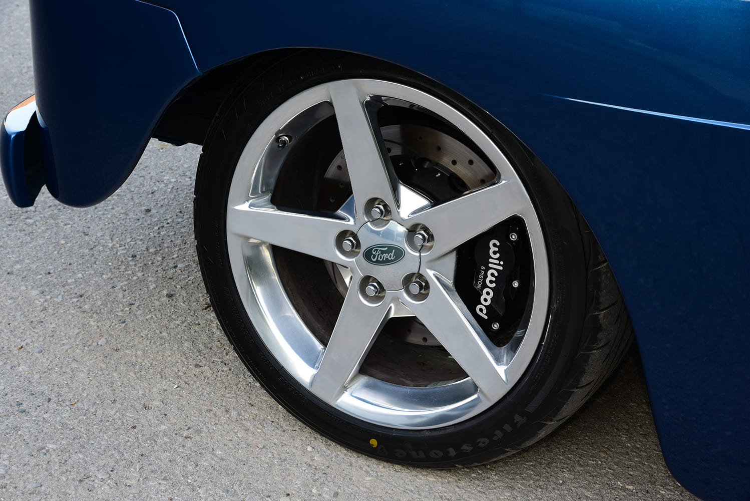 12 1950 Ford F1 rides on five spoke Ford wheels with Wilwood calipers and Firestone Firehawk tires