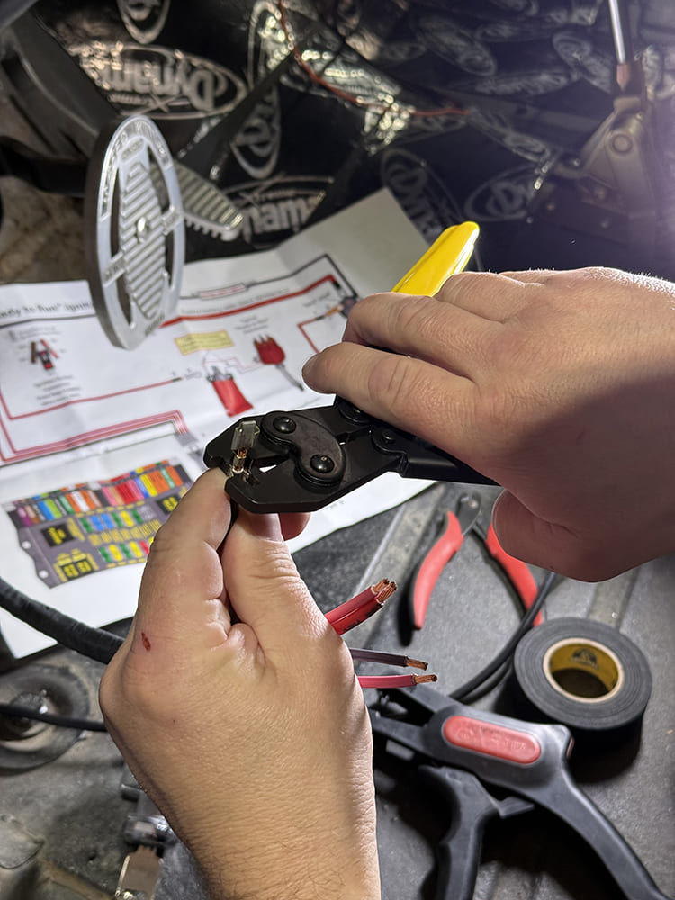 12 Crimping terminals onto ignition wires using yellow handle tool during 1948 Chevy wiring
