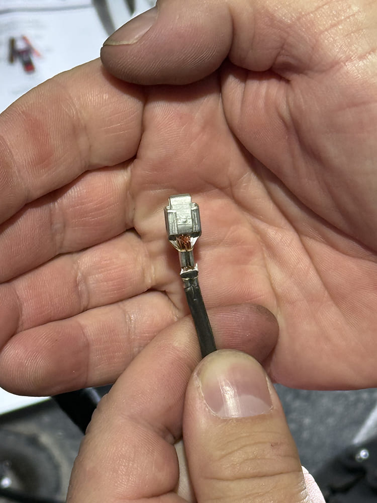 13 Close up of freshly crimped terminal showing proper mechanical connection