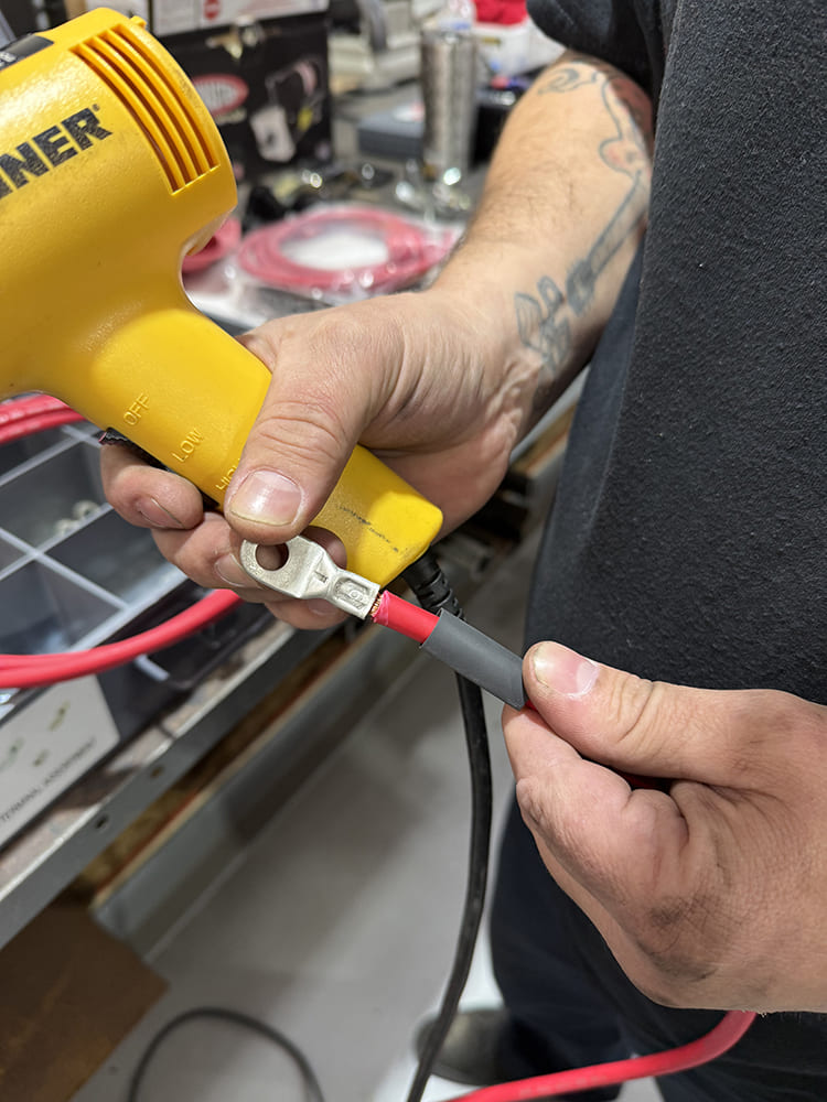 16 Heat gun sealing shrink tube over terminal connection for clean durable finish