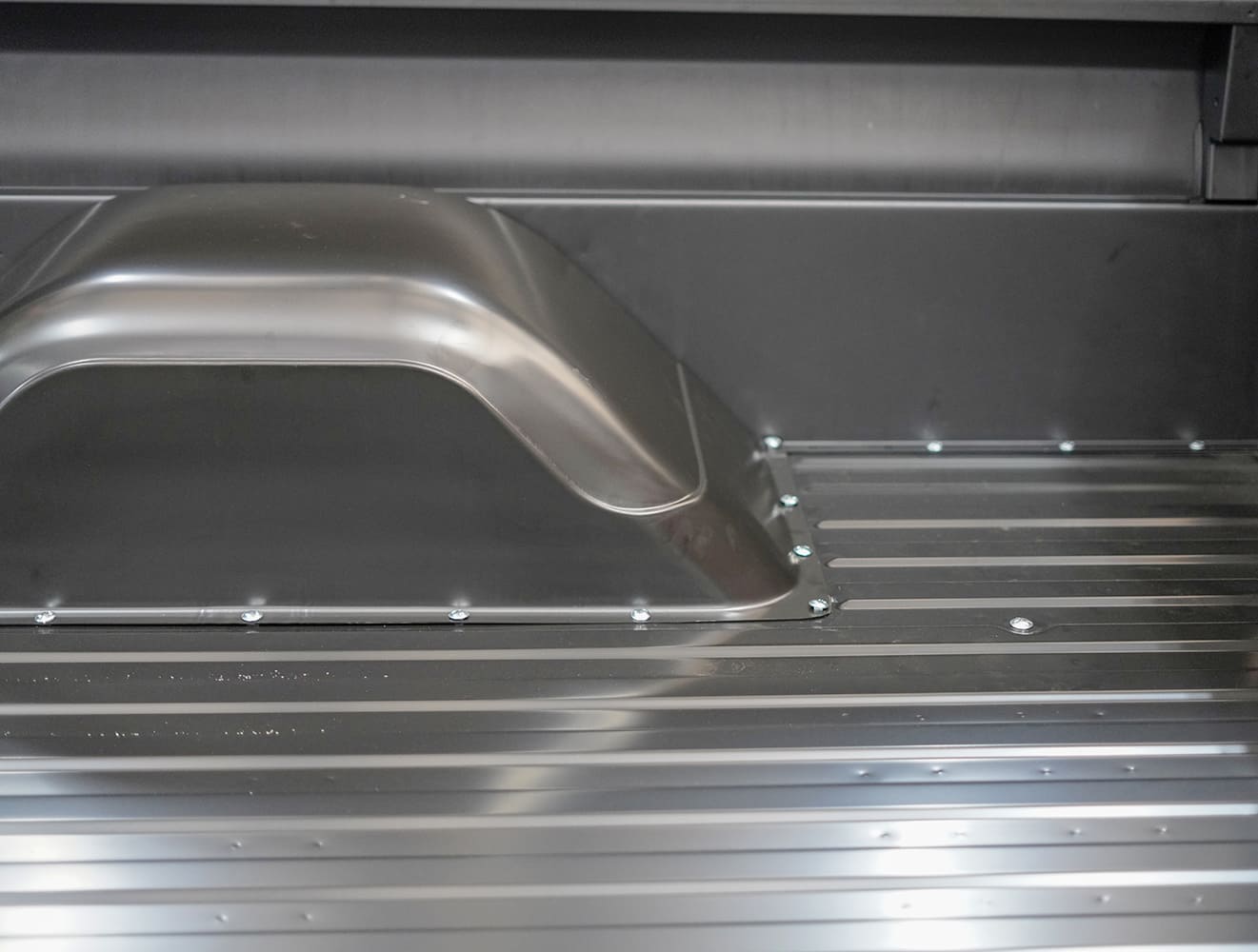 17 Completed passenger side wheel tub fitted and bolted cleanly onto the steel bed floor
