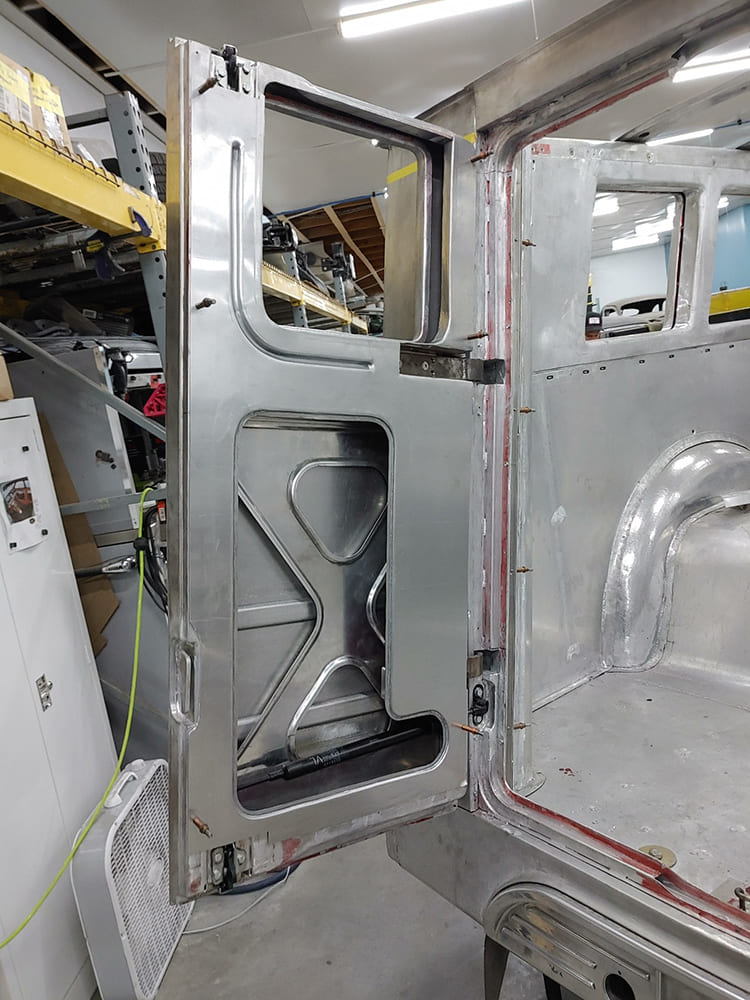 20 1938 Divco rear barn door interior aluminum panel with X brace reinforcement