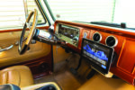 21 1966 Chevy Suburban features an Alpine touchscreen system retro gauges and billet aluminum vents