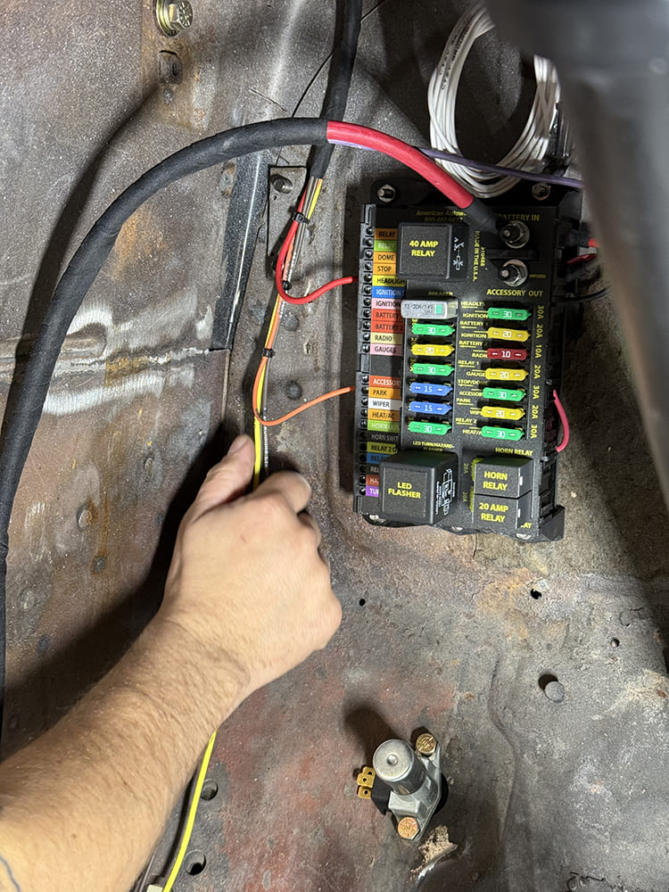 23 Fuse panel wiring continues as tech organizes power distribution and accessory lines