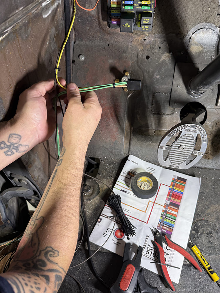 24 Brake light switch wiring being routed and secured behind 1948 Chevy firewall