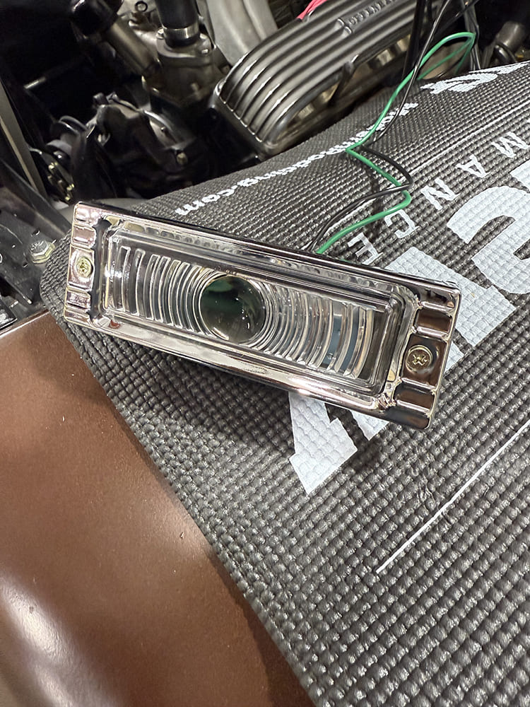 34 Front turn signal lamp prepped with green and black leads for connection