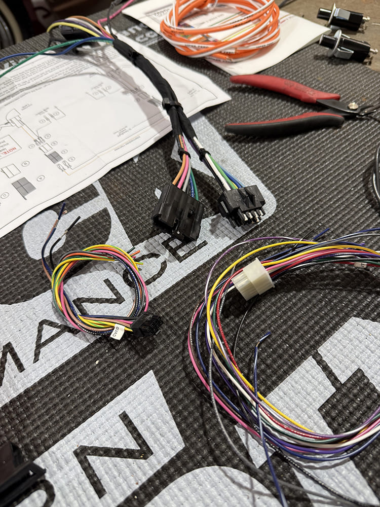 42 Completed gauge wiring harness with labeled connectors ready for dashboard integration