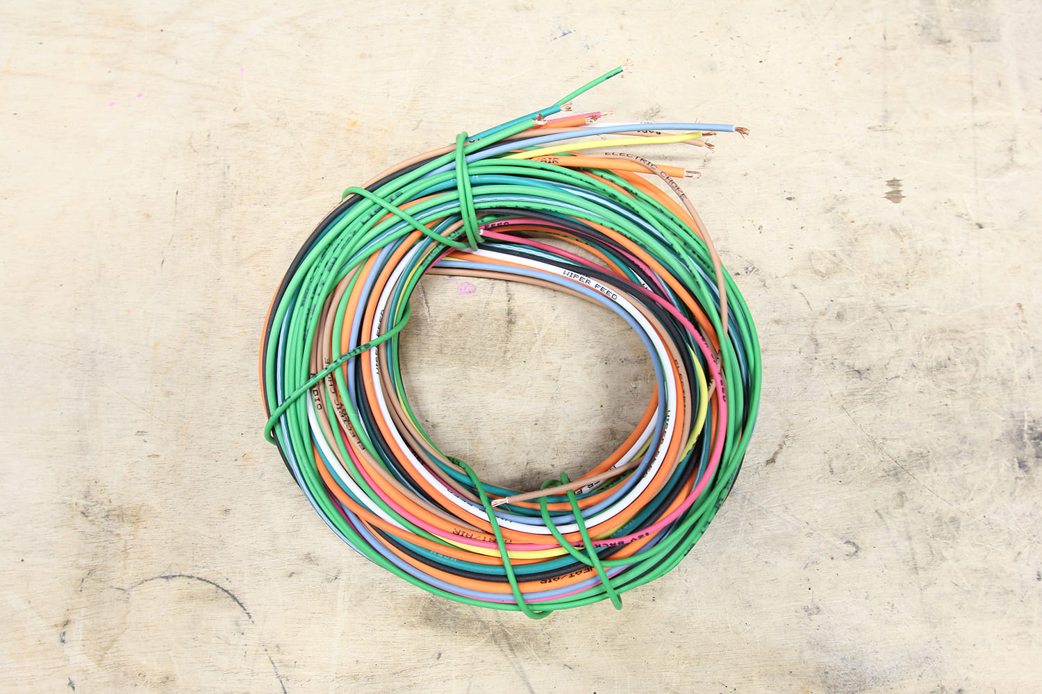44 Coil of color coded wires marked for fuse panel and dash functions