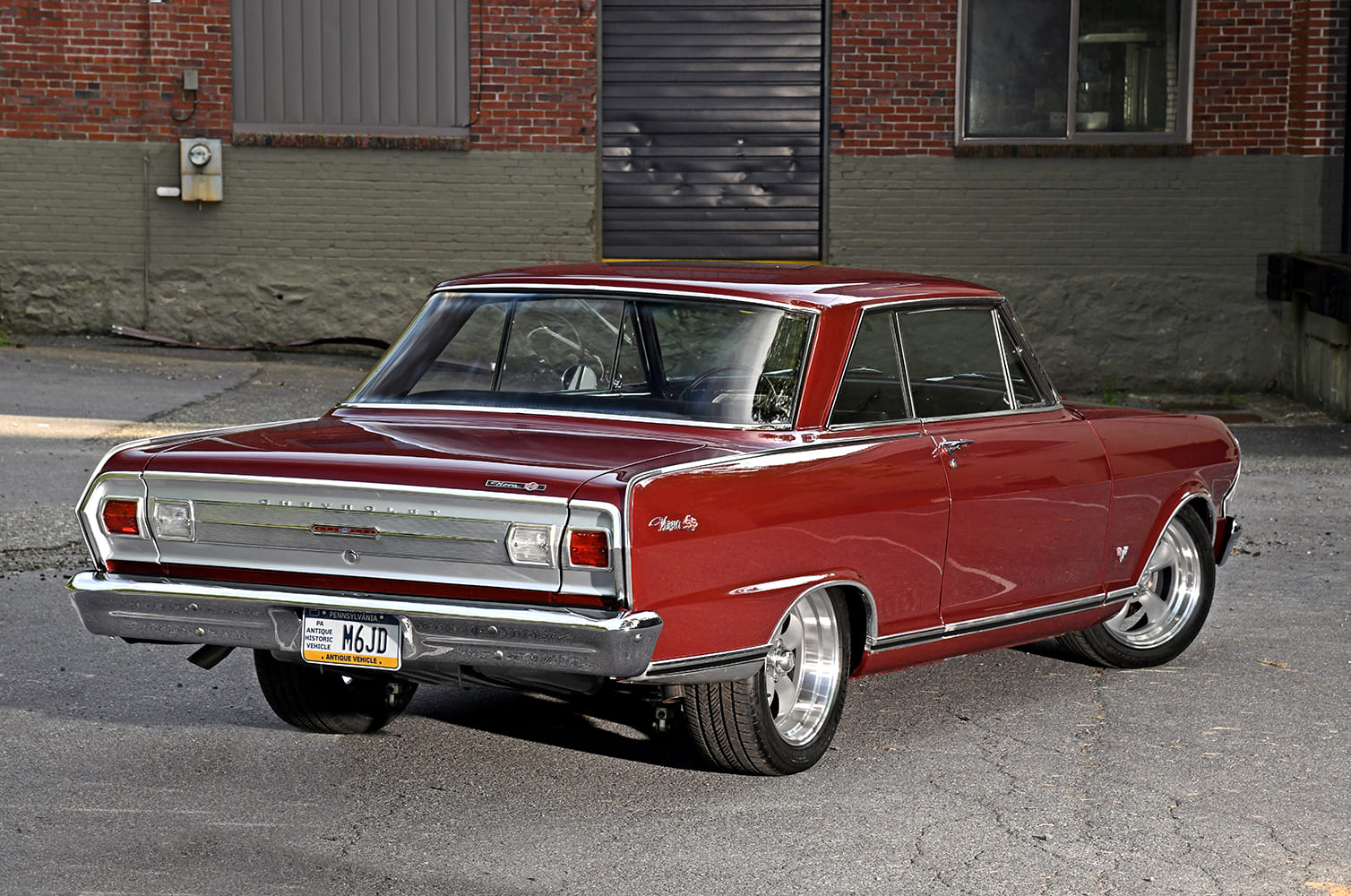 003 1965 Chevy Nova rear view with polished trim and wide modern street tires