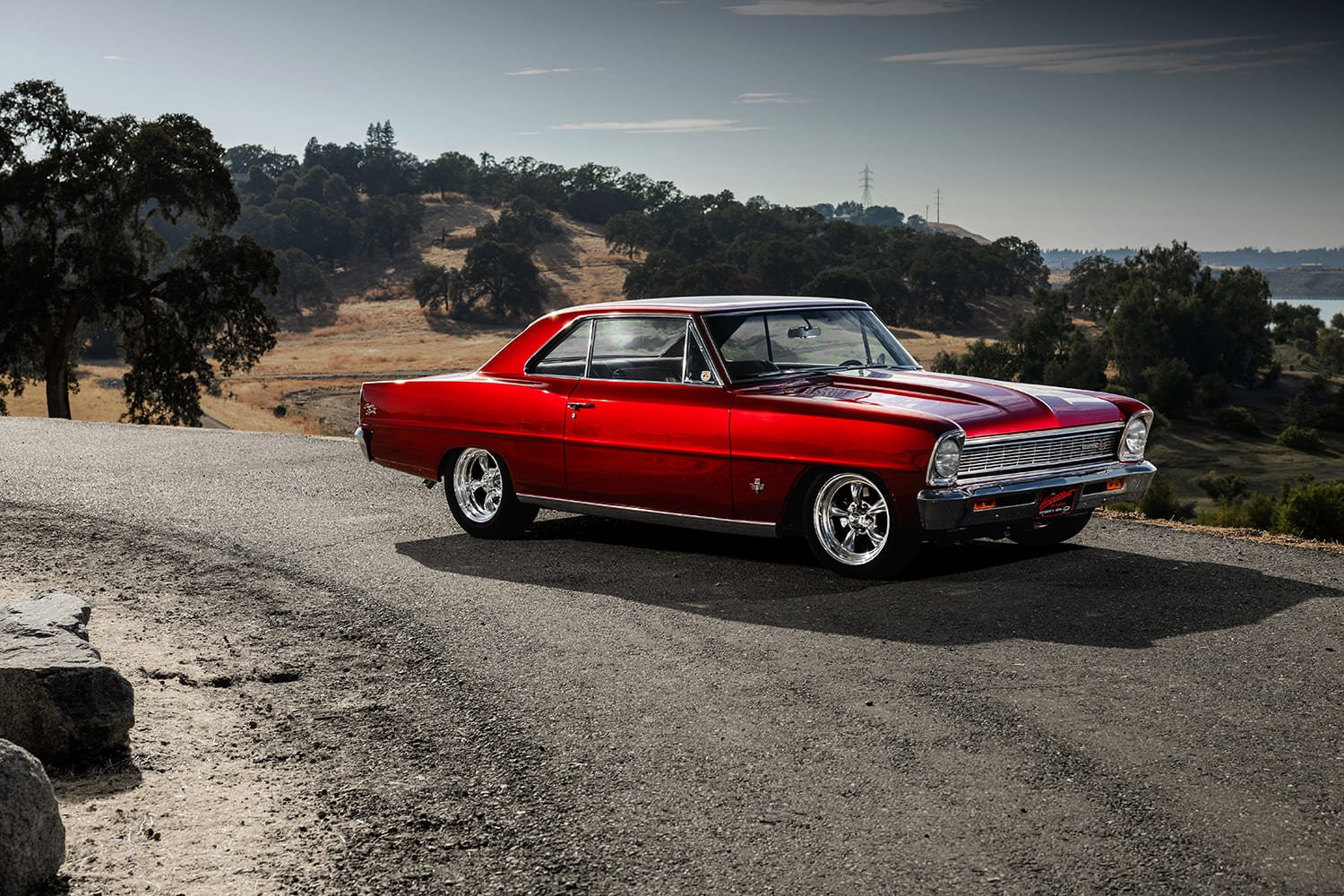 003 1966 Chevy Nova SS coupe in profile with custom paint chrome trim and shaved door locks