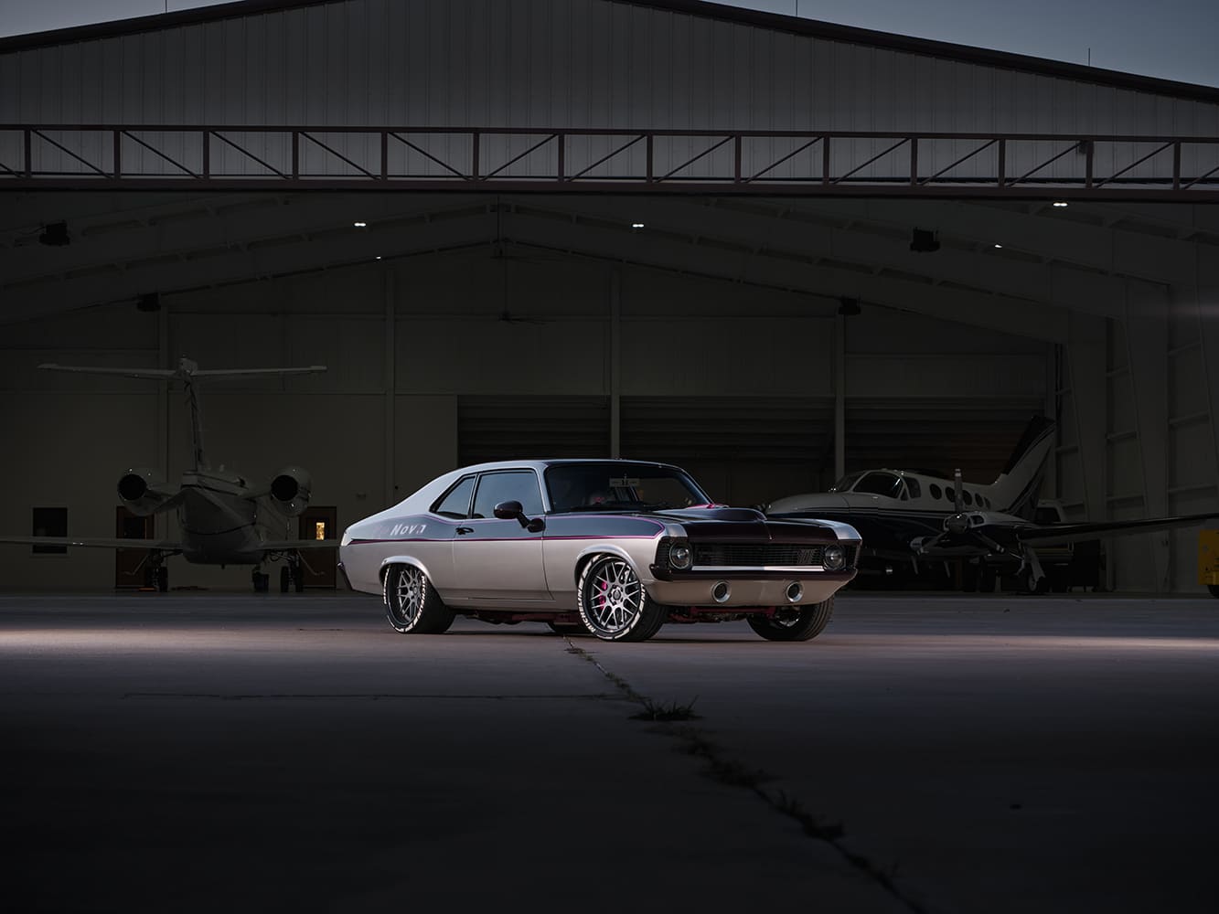 003 1969 Chevy Nova sits low on large multi spoke wheels and Michelin Pilot Sport tires
