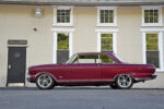 008 1965 Chevy Nova side profile in burgundy with modern five spoke wheels and lowered look