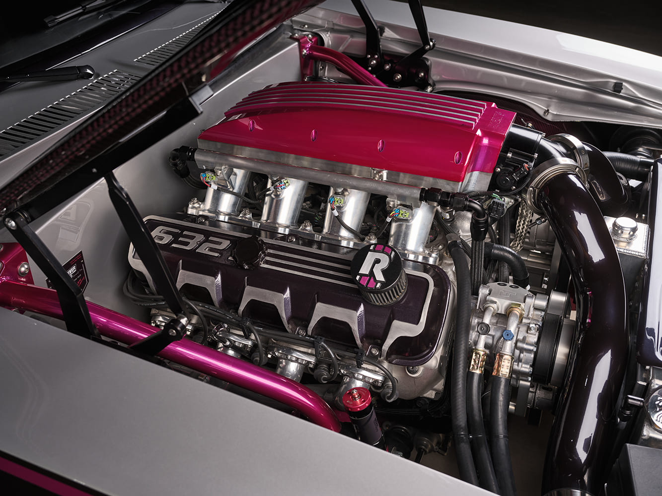 008 1969 Chevy Nova engine bay reveals polished intake runners and billet fuel rails