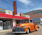 01 1948 Chevrolet 3100 in metallic orange with chrome accents cruising the Ocean City boardwalk