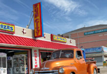 01 1948 Chevrolet 3100 in metallic orange with chrome accents cruising the Ocean City boardwalk