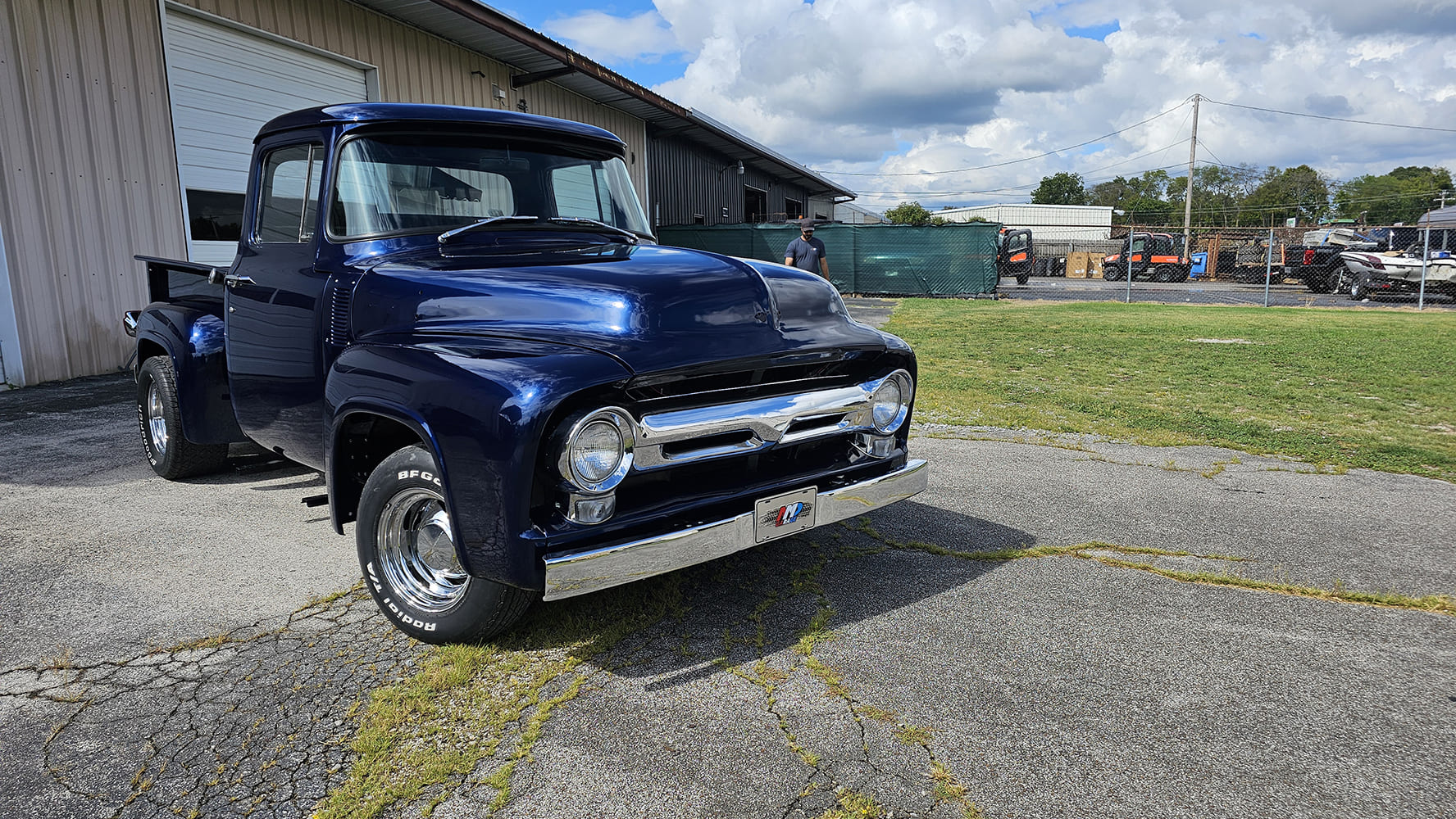 01 1956 Ford F 100 cab corner grinding with cutting wheel throws sparks during metal prep