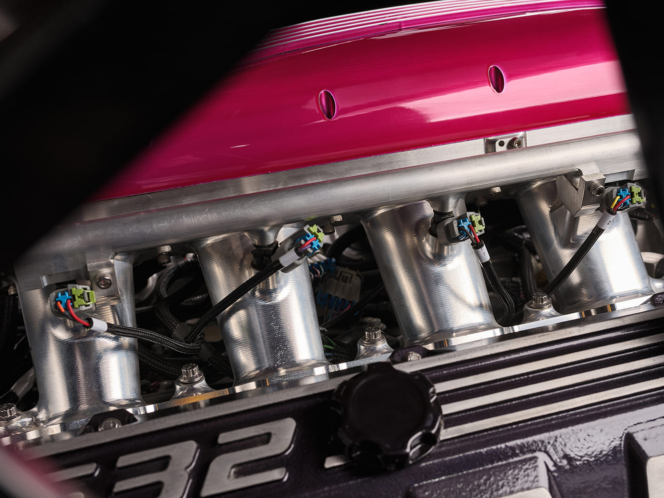 010 1969 Chevy Nova EFI intake shows individual throttle bodies and performance wiring