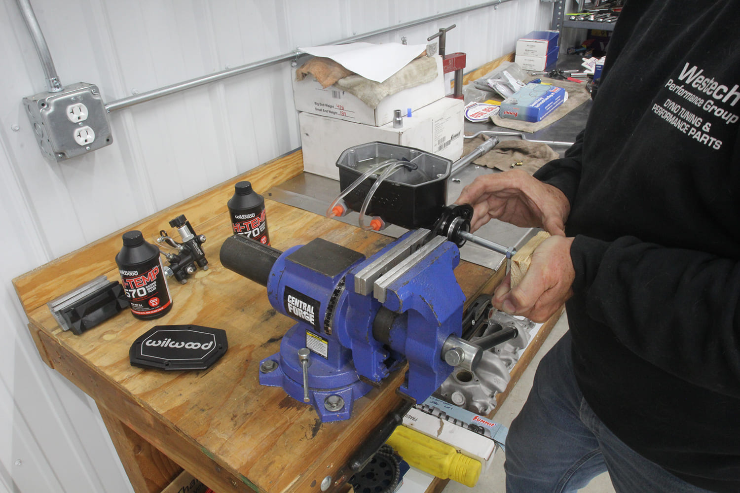 010 Wilwood master cylinder is being bench bled in a vise with high temp DOT 5 1 brake fluid for installation prep