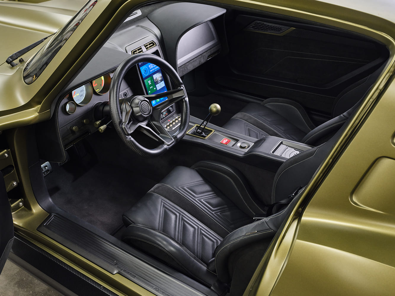 011 1963 Corvette restomod interior digital dash leather buckets carbon accents touchscreen custom steering