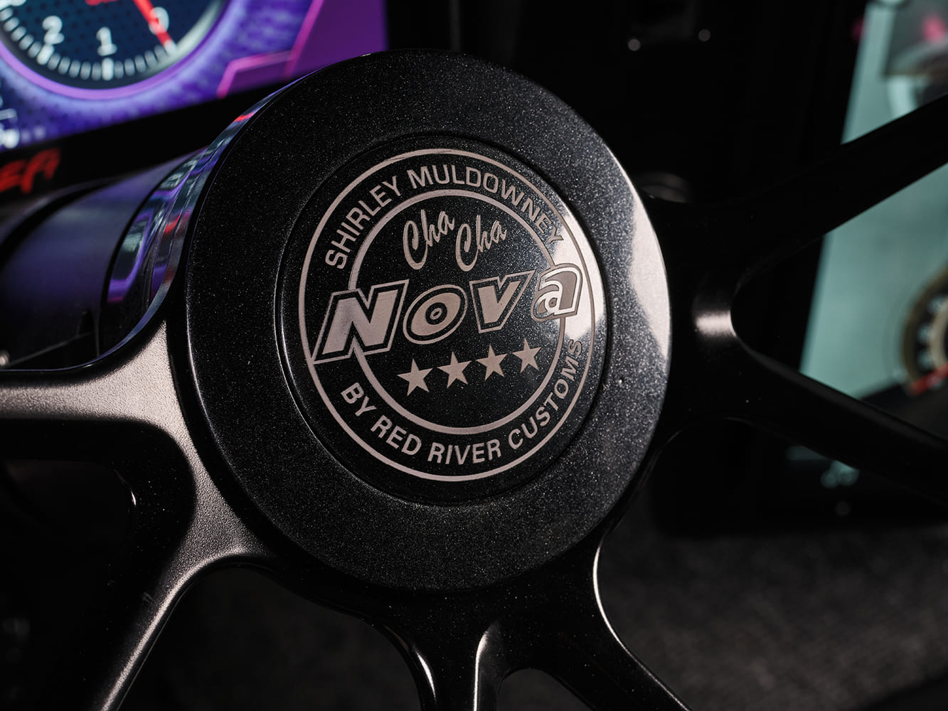 013 1969 Chevy Nova steering wheel badge honors Shirley Muldowney with custom Cha Cha Nova logo