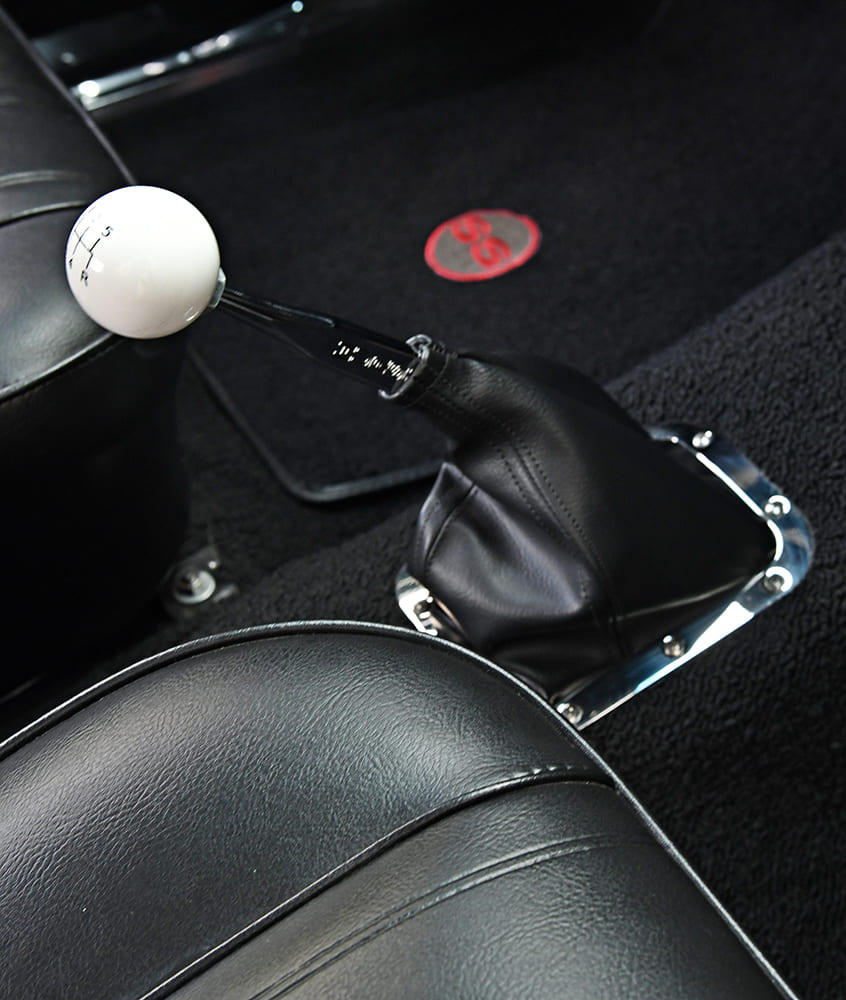 014 1965 Chevy Nova white Hurst shift knob and black leather boot on 4 speed