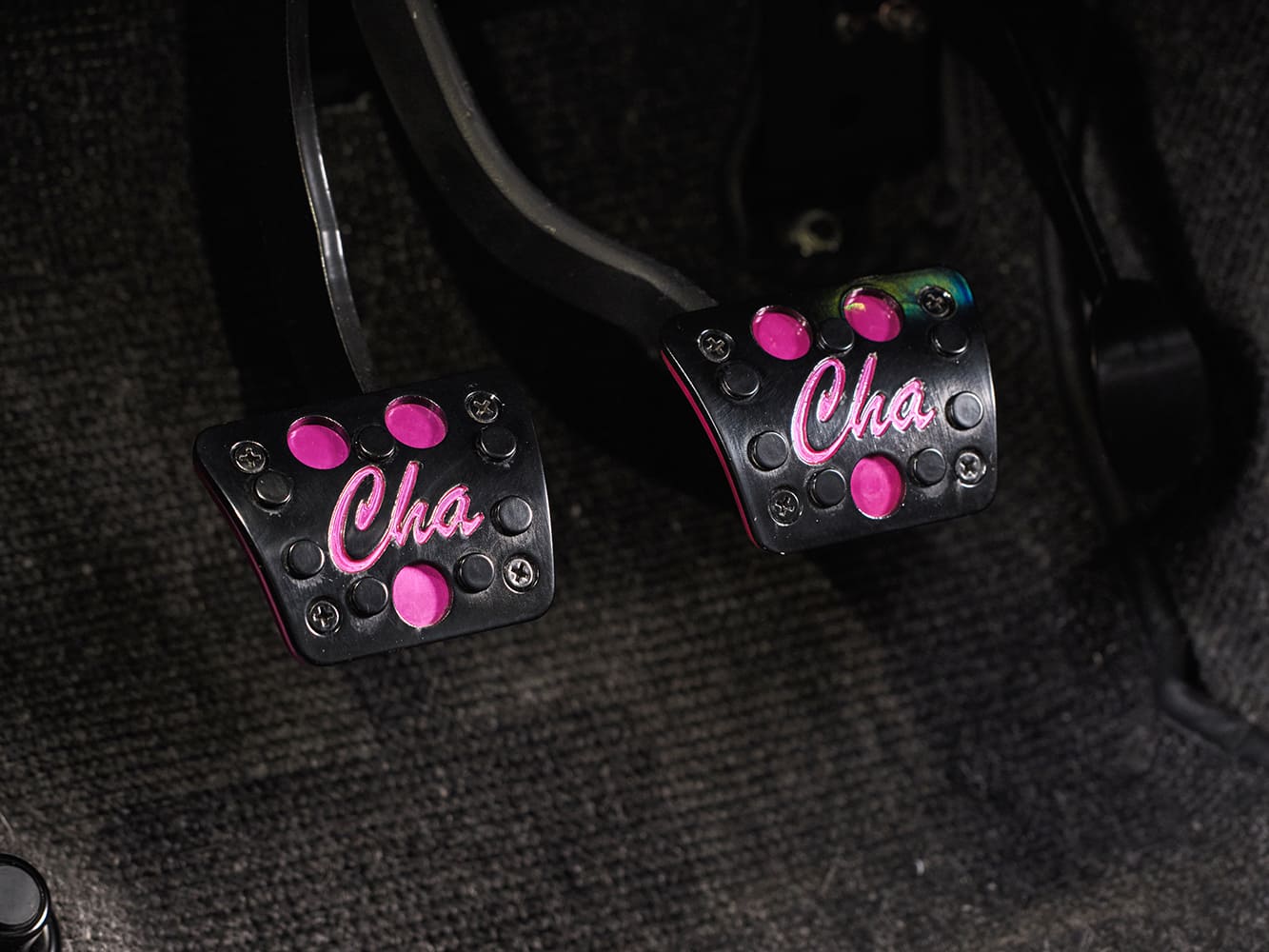 014 1969 Chevy Nova billet pedals engraved with pink “Cha” logos add unique flair