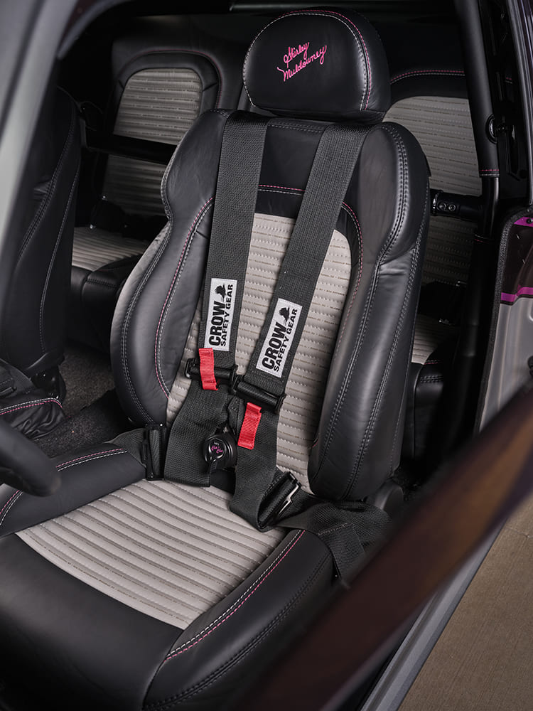 015 1969 Chevy Nova custom seat features Crow harnesses and embroidered Shirley Muldowney headrest