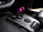 016 1969 Chevy Nova center console sports a pink billet shifter and RRC badging