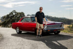 019 1966 Chevy Nova owner poses proudly with his restored red SS coupe