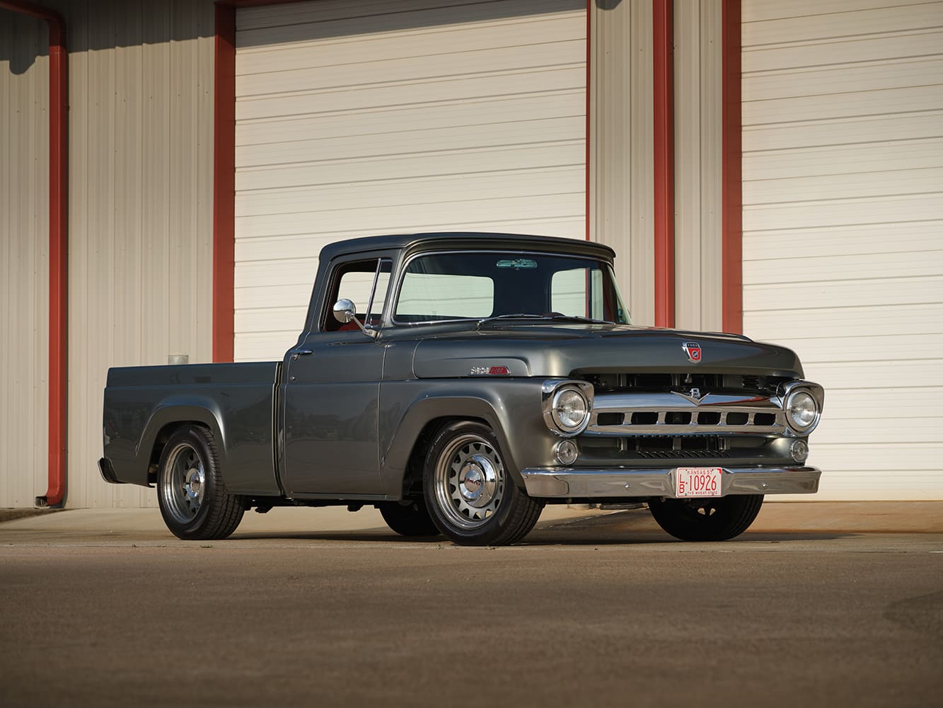 02 1957 Ford F 100 lowered stance with smooth body lines and custom grille badging