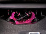 021 1969 Chevy Nova trunk mounted QA1 coilovers showcase anodized pink brackets and reservoirs