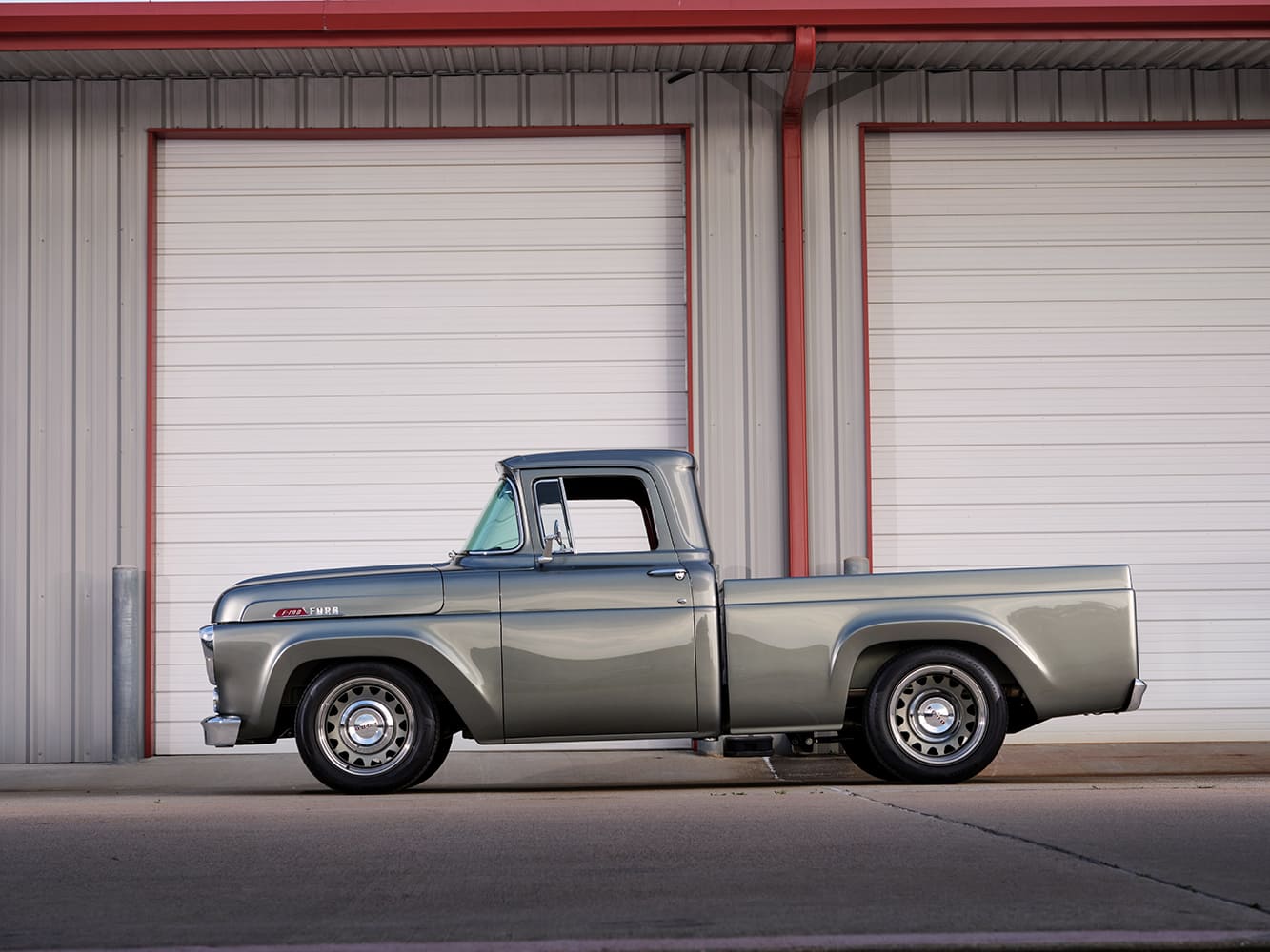 03 1957 Ford F 100 side profile with billet wheels and shaved door handles