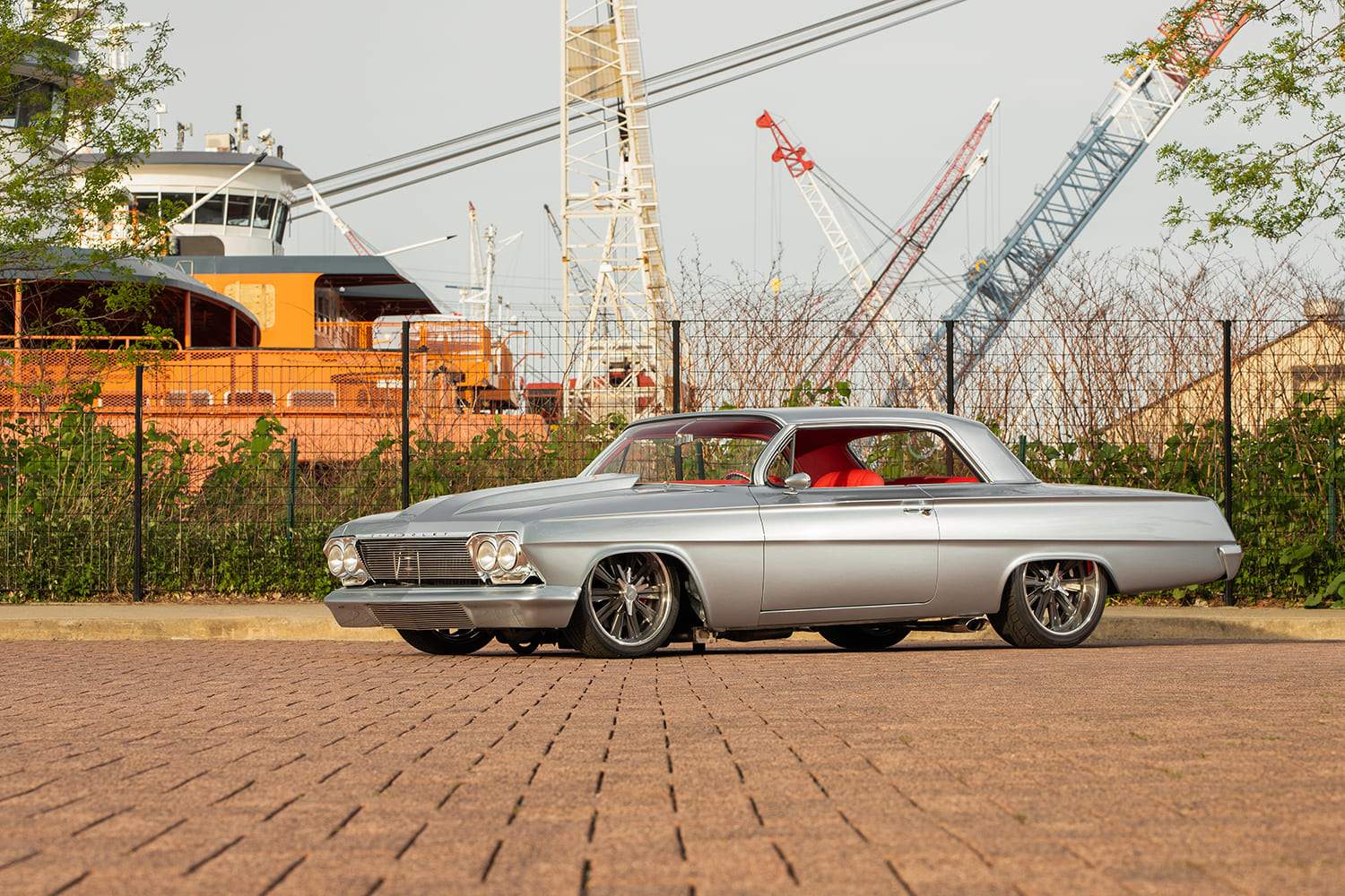 03 1962 Chevy Impala front three quarter view with smoothed hood and custom grille