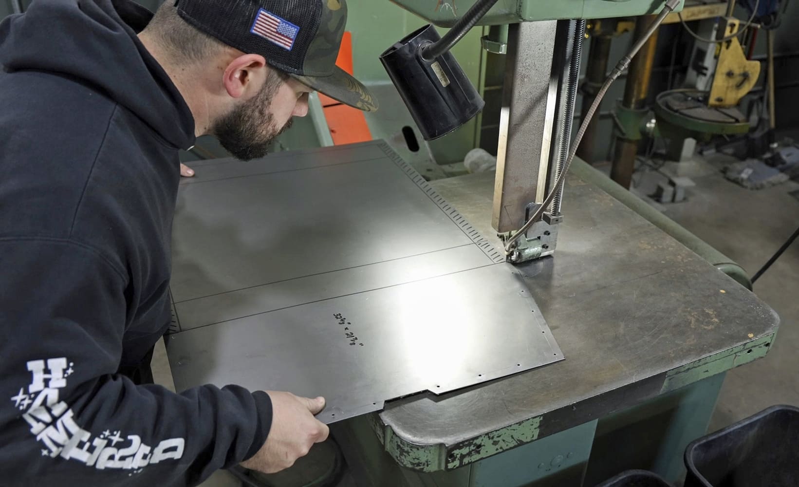 04 1962 Chevy convertible floor section being cut on vertical bandsaw