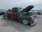 05 1952 GMC 100 with turquoise engine bay and plaid interior sporting static dropped stance
