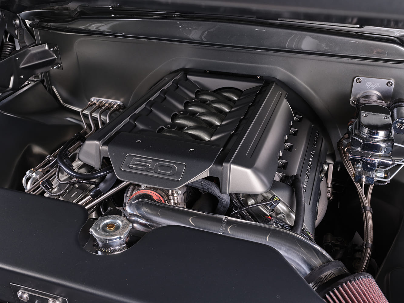 05 1957 Ford F 100 engine bay featuring Ford 5 0L Coyote crate motor swap