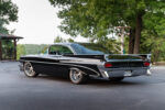 05 1959 Pontiac Catalina rear view showcases jet style taillights and custom exhaust cutouts