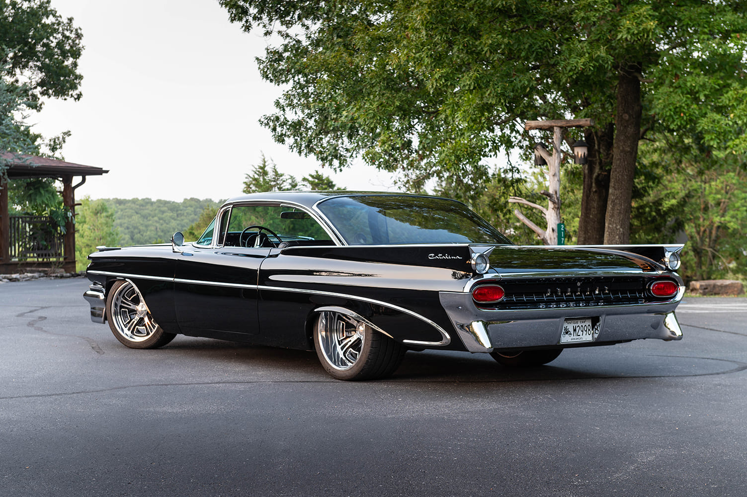 05 1959 Pontiac Catalina rear view showcases jet style taillights and custom exhaust cutouts