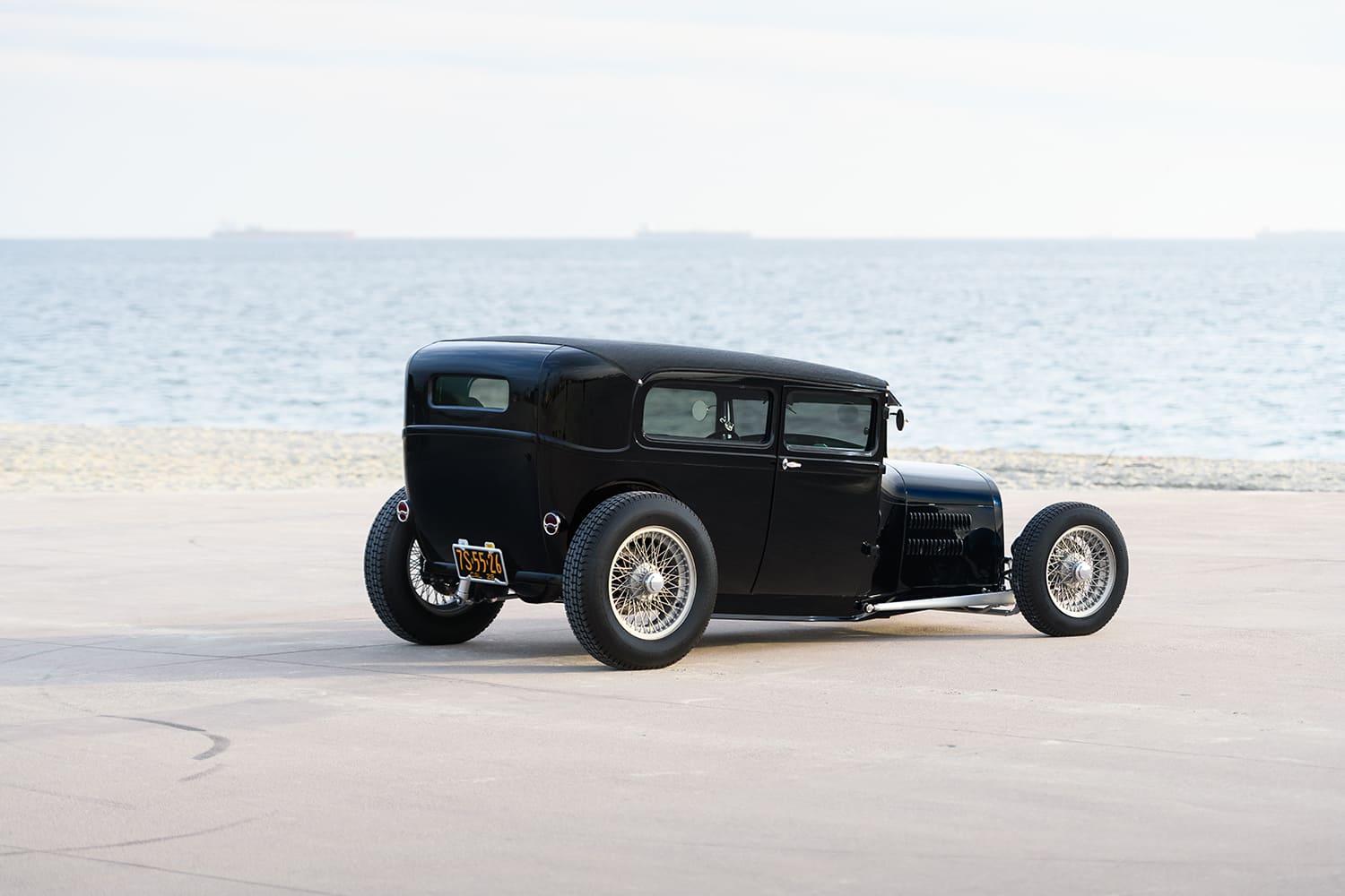 06 1929 Ford Tudor rear three quarter view with smooth tail panel and California black plates